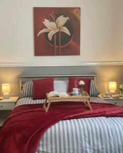a bedroom with a bed with a table on it at Black Forest Oase in Gaggenau