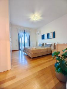 a living room with a bed and a couch at V Mira Luxury Villa in Tragaki +37 photos