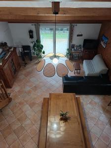 a living room with a couch and a table at Gîte le logis in Mouchamps
