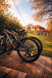 a bike is parked on a wooden deck at Uíma River House in Lobão
