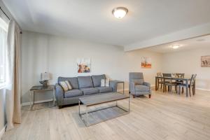 a living room with a couch and chairs and a table at Relax Poolside: Central Group Getaway in Mesa! in Mesa