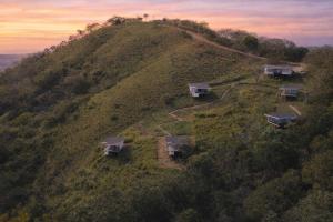 an aerial view of a house on a hill at Nosara Hideaway 3 - BREAKFAST AVAILABLE & Mountain View Cabins in Nosara