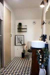 a bathroom with a sink and a toilet at Pause Pedal Pyrénées in Capvern +51 photos