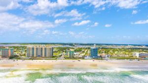 an aerial view of a beach and buildings at Beach Studio with Partial Water Views Sundeck Pool in Daytona Beach