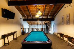a pool table in the middle of a room at The Sierra House in Mammoth Lakes