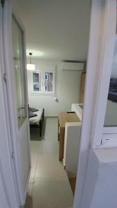 a room with a kitchen and a living room at Harbor View Apartment Athens in Piraeus