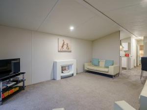 a living room with a couch and a fireplace at The Paddocks - Uk7112 in Alloa