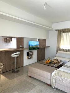 a bedroom with a bed and a flat screen tv at Comfortable and Fresh Apartment in Tunis