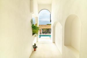 a hallway of a house with a swimming pool at Casa Nami in Puerto Escondido