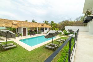 an image of a villa with a swimming pool at Casa Nami in Puerto Escondido