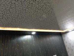a ceiling in a bathroom with a shower with at Hotel p p inn in Agra