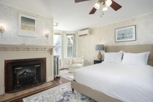 a bedroom with a bed and a fireplace at The Berkshire Mountain Inn in Great Barrington
