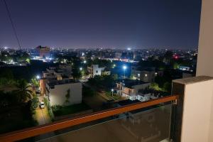 a view of a city at night from a balcony at 1 Bhk Mayra Homes in Raipur