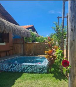 a pool in the backyard of a house at Chalé Pitanga in Pôrto de Pedras