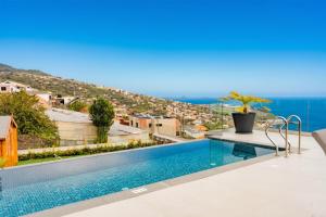 a swimming pool on the roof of a house at Ocean View Villa, Private Pool and Terrace in Santa Cruz