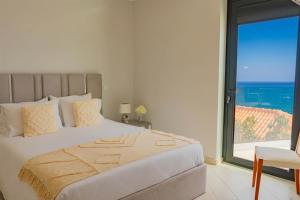 a bedroom with a large bed with a large window at Ocean View Villa, Private Pool and Terrace in Santa Cruz +33 photos