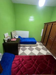 a bedroom with a bed and a desk in a room at spacious ground floor apartment in Taroudant +2 photos