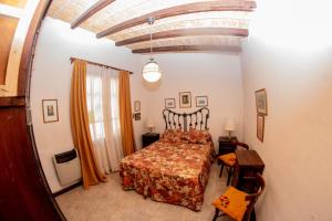 a bedroom with a large bed in a room at Tilcara Casa con 3 dorm Pedacito de Cielo in Tilcara