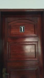 a close up of a wooden door at Bonito é ser Feliz Budget in Recife