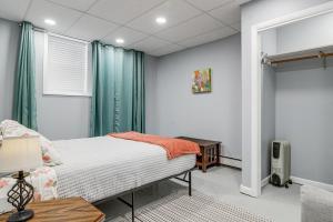 a small bedroom with a bed and a window at Downtown Casper Gem! Super Walkable Apartment in Casper