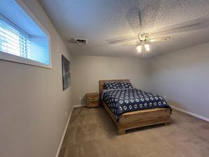 a bedroom with a bed and a ceiling fan at The Palace in Mandan