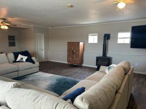 a living room with a couch and a fire place at The Palace in Mandan