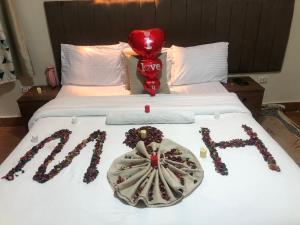 a bed with christmas decorations on it at Giza Pyramids& GYM View in Cairo