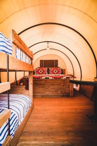 a room with two bunk beds in a building at Big Texan Wagons in Amarillo +24 photos