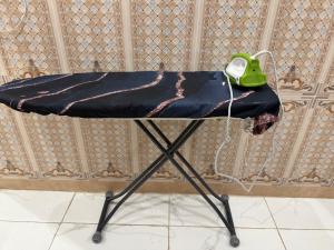 a table with a phone sitting on top of it at النبلاء الماسي in Medina