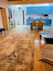 a living room with a couch and a table at Luxury Mamaia Central in Mamaia