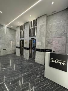 a lobby with a sign in the middle of a building at Sirena Apartment Tangier in Tangier