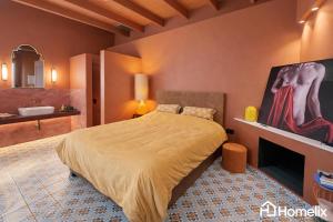 a bedroom with a bed and a bathroom with a sink at Santa Clara - the revolution of living in Chalkida