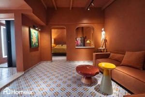 a living room with a couch and a table at Santa Clara - the revolution of living in Chalkida
