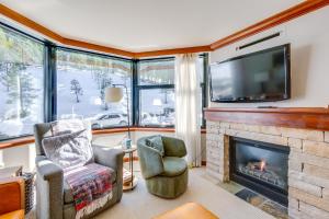 a living room with a fireplace and a flat screen tv at Everline Suite w/ Resort Perks! 7 Mi to Lake Tahoe in Olympic Valley