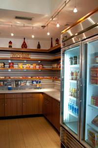 a kitchen with a refrigerator with food inside of it at SpringHill Suites by Marriott Las Cruces in Las Cruces