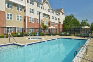 a swimming pool in front of a building at Residence Inn Baltimore White Marsh in White Marsh