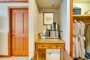 two images of a kitchen with a microwave and a door at Olympic Valley Summer Sanctuary in Everline Resort in Olympic Valley