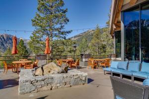 a patio with a fire pit and tables and chairs at Olympic Valley Summer Sanctuary in Everline Resort in Olympic Valley