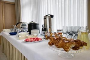 a table with food on it with plates of food at Ośrodek TVP in Ciechocinek