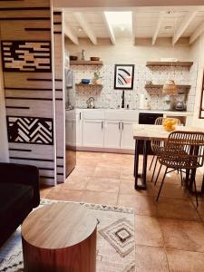 a kitchen with a table and chairs in a room at Serenity in Santa Fe +24 photos