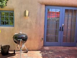 a bbq grill sitting outside of a house at Serenity in Santa Fe