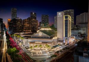a city skyline with a sony building at night at Caesars New Orleans, A Caesars Rewards Destination in New Orleans