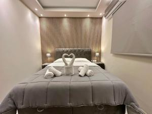 a bedroom with a bed with two towels on it at Aggelos Room 2 in Volos +1 photo