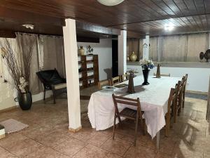 a dining room with a table and chairs at Chateau Magalhães in Itatiba