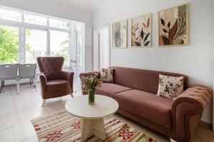 a living room with a couch and a table at Kaya Apart Datca in Datca
