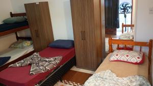 a room with two bunk beds in a room at Pousada Joinville in Joinville +22 photos