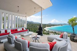 a living room with a view of the ocean at STK Villa Samui Paradise Awaits in Nathon Bay