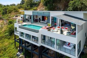 an aerial view of a house with a swimming pool at STK Villa Samui Paradise Awaits in Nathon Bay