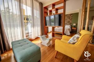 a living room with a couch and a table at Suite Picchu Picchu in Arequipa