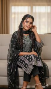 a woman is sitting on a couch at Mohammed in Dirē Kʼalu